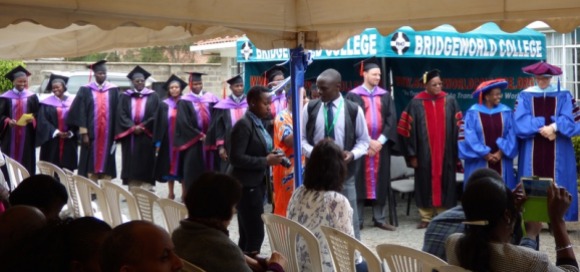 Lecturers lined up to congratulate graduates after they received their diplomas.
