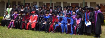 Ceremony participants, lecturers and graduates. Ryan is seated near the right hand edge, in the second row.